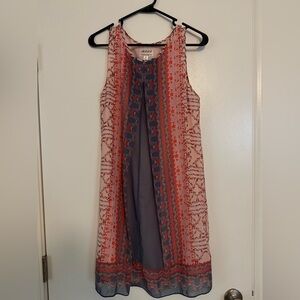 Elegant Sleeveless Dress with Red and Blue Accents